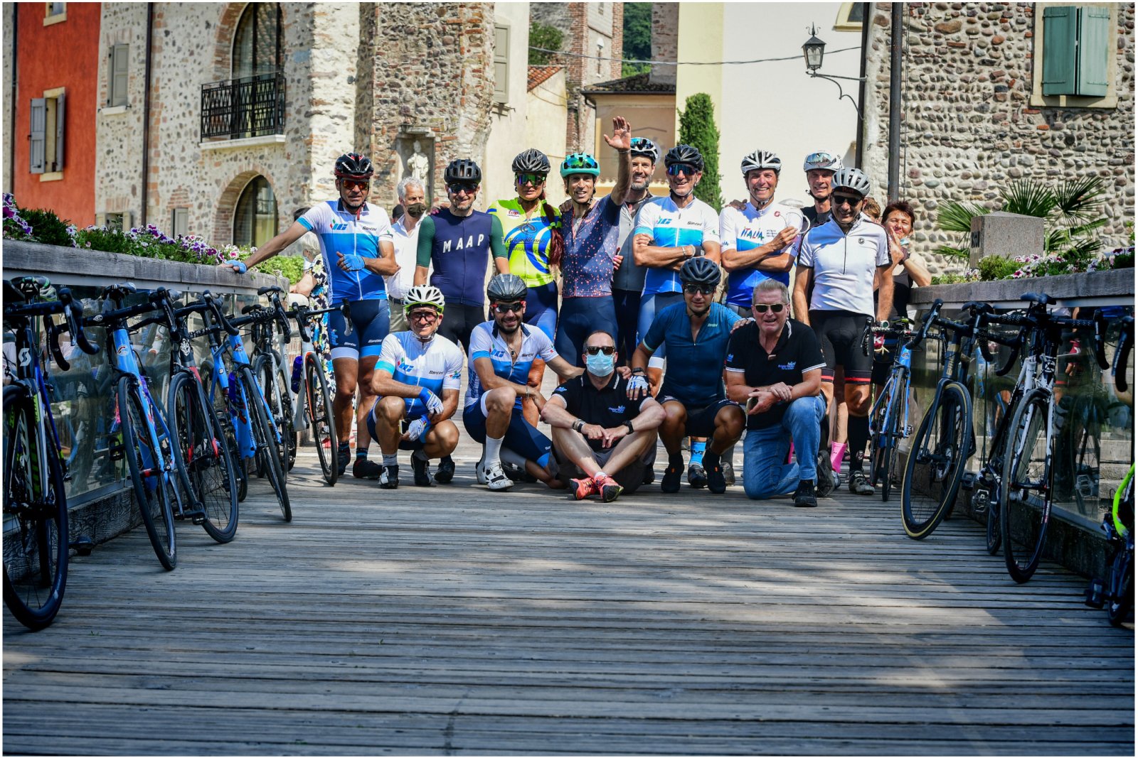 Cyclists toast in italian village